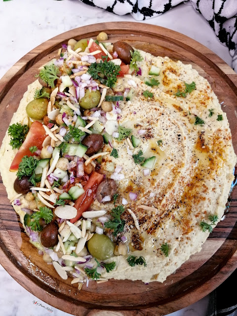 Palestinian Hummus, Palestinian food, Palestinian cuisine, hummus, Palestine, Middle Eastern cuisine, food, food blog, food blogger, food photography, tiktok food, tiktok recipe, chickepeas, garlic, keffiyeh, pinterest food, food flatlay, Palestinian pita bread, pita bread, Palestine London march, olives, olive oil, za'atar, sumac, tanini, home-made hummus, hummus recipe, loaded hummus, healthy food, healthy recipe, appetiser, appetizer, side dish, easy recipe, almonds, spicy fusion kitchen