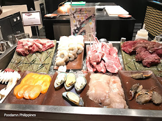 meat and seafood at japanese station in spiral buffet