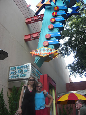 Photo of my sister & I Standing below the Sci Fi drive in restaurant