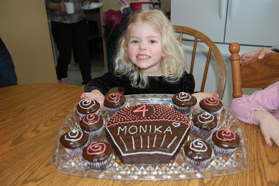 birthday girl with cake and cupcakes