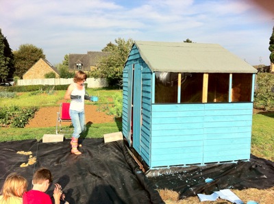 Frances paints shed allotment Wardington UK 2