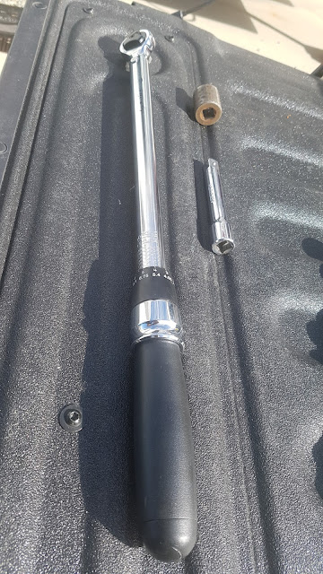 Buy yourself a good quality torque wrench with an extension  3/4 inch drive.