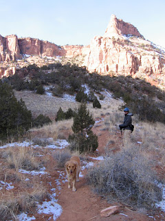 John and Scout working their way up to the Wingate Sandstone spires of Devil's Canyon