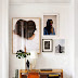 Stylish Eclectic Loft With Clusters Of Art And Framed Photographs  