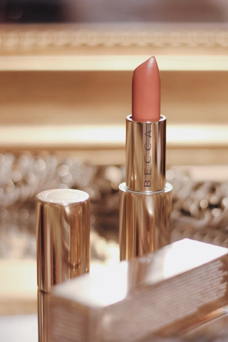 macro shot of nude becca lipstick with blurred background