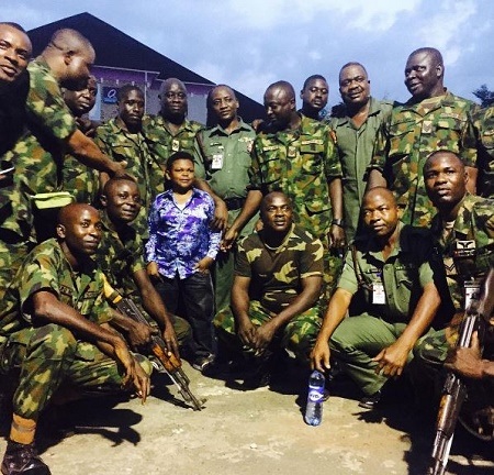 Excited Nigerian Soldiers Surround Osita Iheme 'Pawpaw', Confer On Him New Title (See Photo)