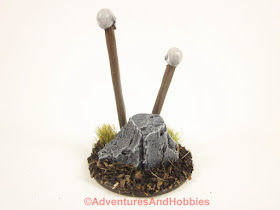 Rear view of T1582 skull totems designed for 25 to 28mm scale miniature wargames.