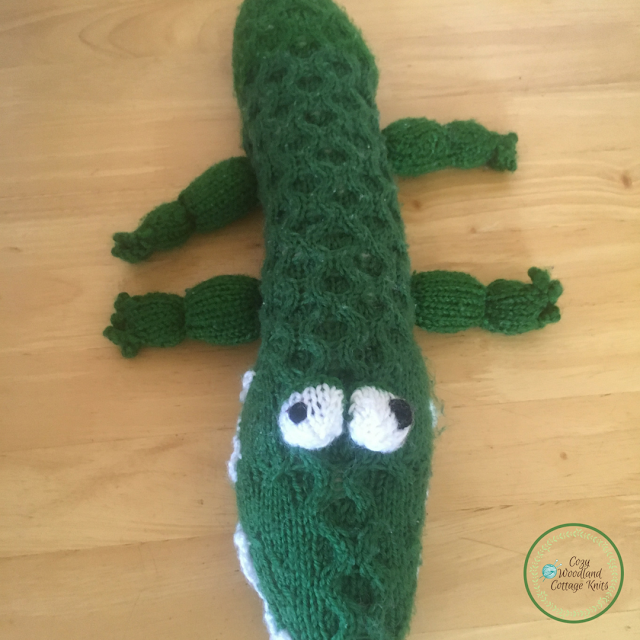 Knitted crocodile soft toy