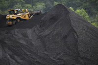 A coal mound in Shelbiana, Kentucky. A National Academies panel has issued a ringing endorsement of the work of the U.S. Global Change Research Program, which is under threat by the Trump administration. (Credit: Luke Sharrett/Getty Images) Click to Enlarge.