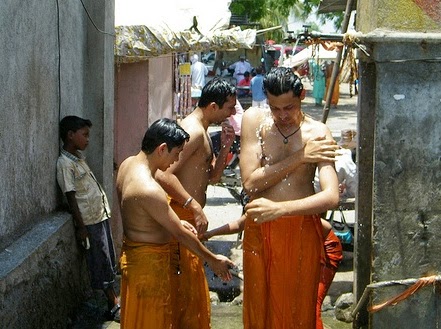 Devotees taking bath before going  to temple