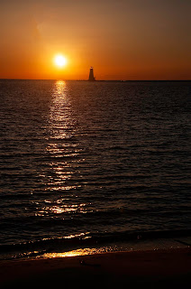Setting sun on Lake Michigan vertical