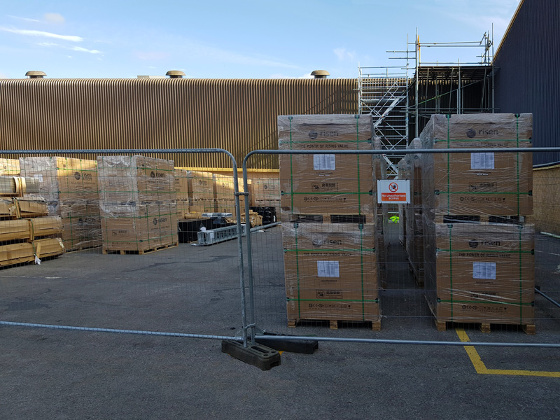 Hundreds of solar panels all lined up ready to go on the roof