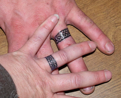 This wedding rings tattoo is very professionally done.