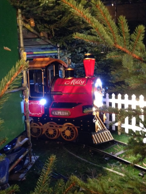 A photo of the red childrens train called Milly in Edinburgh's Christmas market.