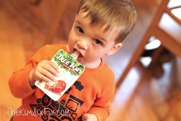 Baby eating applesauce