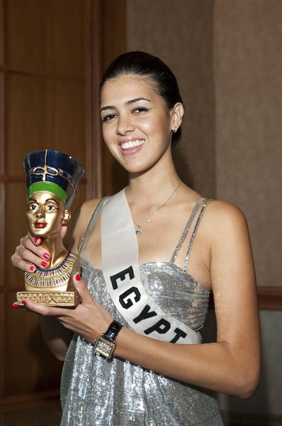 Donia Hamed Miss Egypt 2010 poses with her national gift at the Miss 