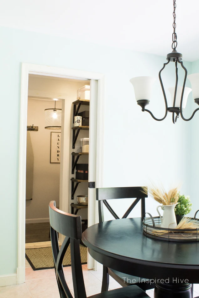 An industrial farmhouse combined pantry and laundry room