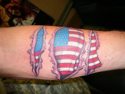 Flag under skin tattoo.