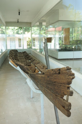 A preserved balangay, or balanghai, which is an ancient seafaring vessel is displayed at the Balanghai Shrine Museum