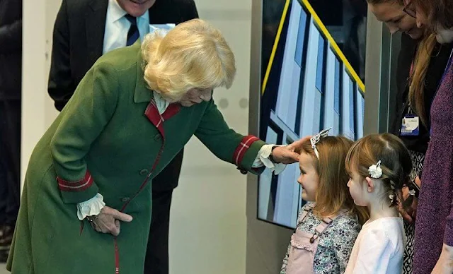 Camilla, Queen Consort wore a green wool coat and brown boots. Queen Camilla is the Chancellor of the University of Aberdeen