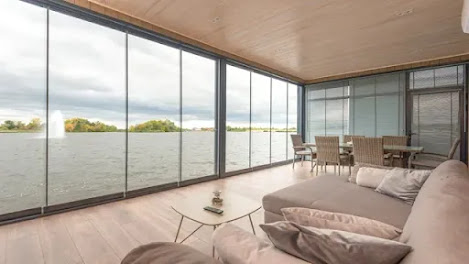 A dining and drawing room area with sea view facing