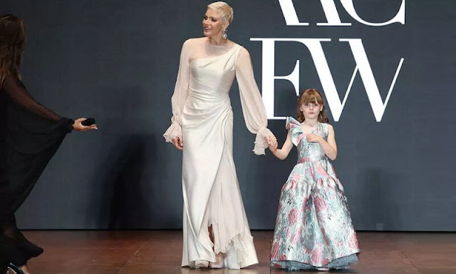 Princess Charlene and Princess Gabriella wore custom-made gowns by Terrence Bray. Repossi jewels pearl and gold earrings