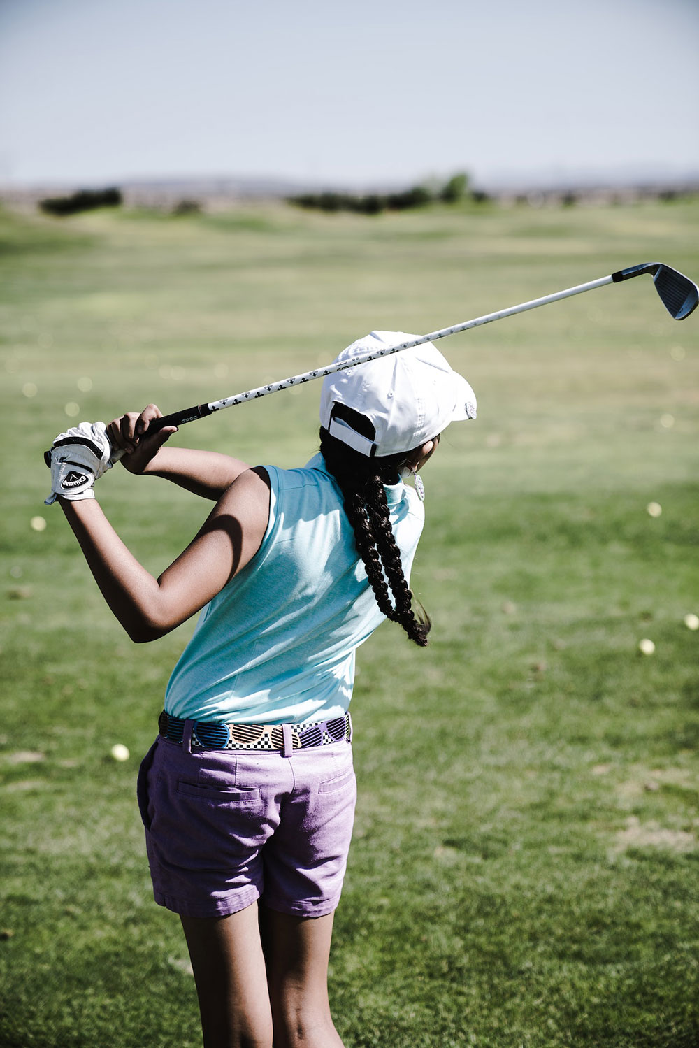 Girl playing golf