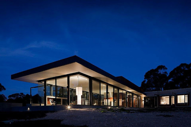 Rectangular Shape, Glass Windows, Black Trims and Wooden Wall Siding