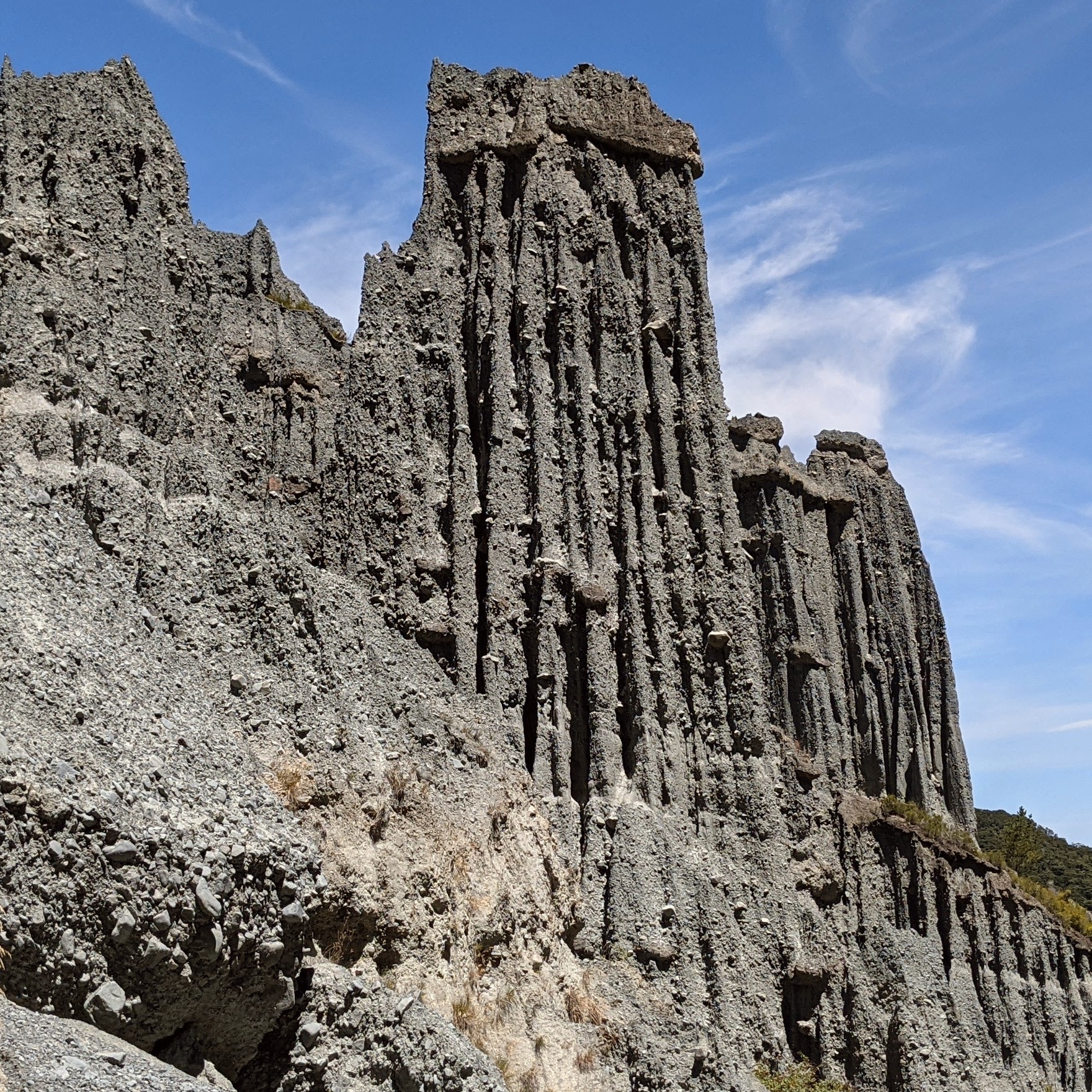 One of the many Putangirua Pinnacles against a blue summer sky