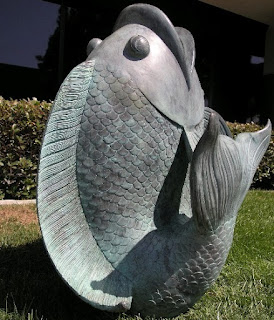 Statue of a fish pointed upward