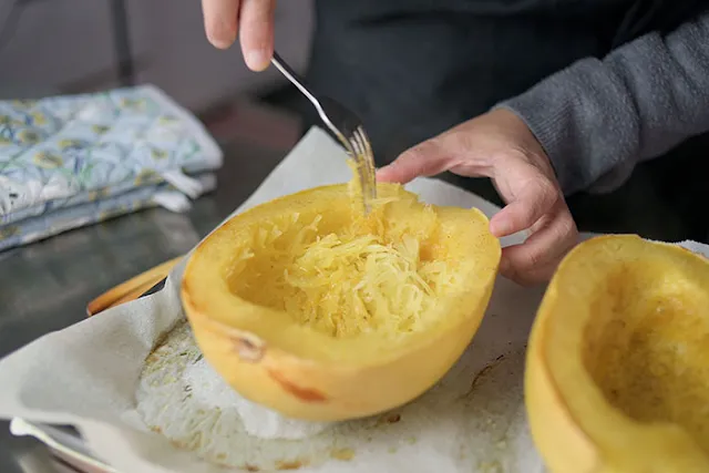 Fluff spaghetti squash with fork