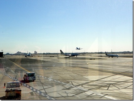 Busy airport, busy picture with shadows and reflections.