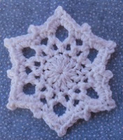 http://www.ravelry.com/patterns/library/snowflake-coaster-or-ornament