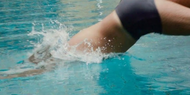 Man jumping into the pool