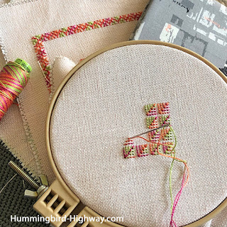 Brightly colored embroidery on a hoop