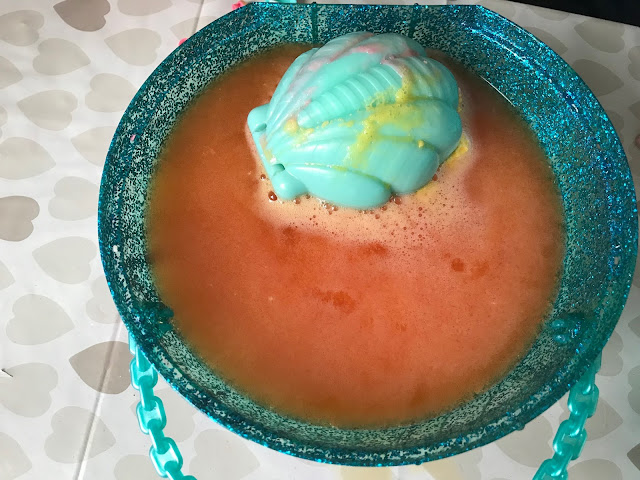 L.O.L bathbomb fizzing in bowl of water 