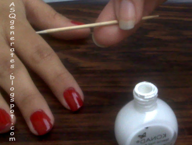 Grab white nail polish and toothpick