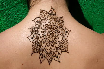 While applying henna dye to the skin to create a temporary tattoo