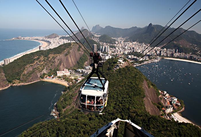 Sugarloaf Mountain, is a peak situated in Rio de Janeiro, Brazil, at the mouth of Guanabara Bay on a peninsula that sticks out into the Atlantic Ocean. Rising 396 metres (1,299 ft) above the harbor, its name is said to refer to its resemblance to the traditional shape of concentrated refined loaf sugar.