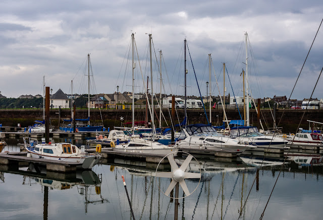 Photo of reflections in the still water at Maryport Marina on Sunday evening