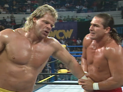 WCW Starrcade 1991 - The Tailormade Man wrenches the arm of The Total Package