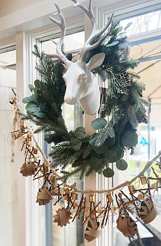 reindeer with wreath and garland