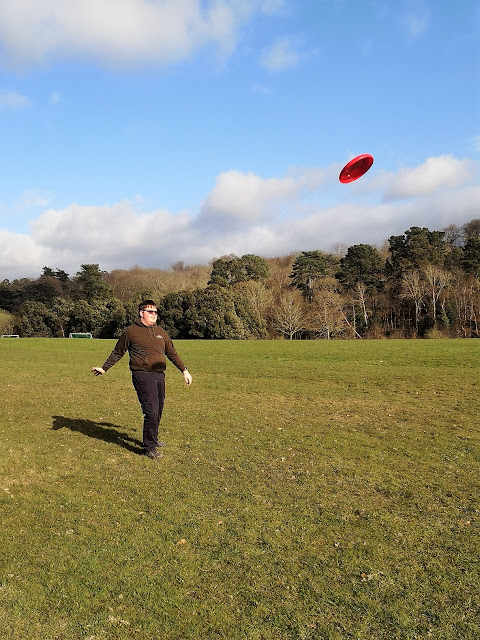 Teen throwing frisbee