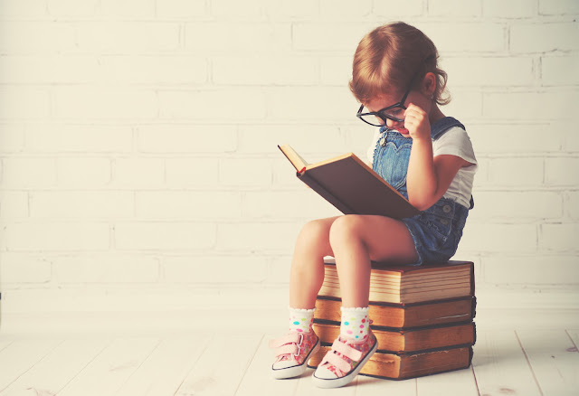 Child reading books