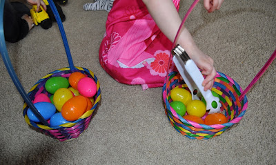 Build fine motor skills by using tongs and plastic Easter eggs