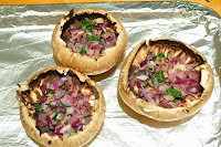 mushroom gills removed layered with spinach and red onion