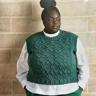 Model wearing a hand knitted top
