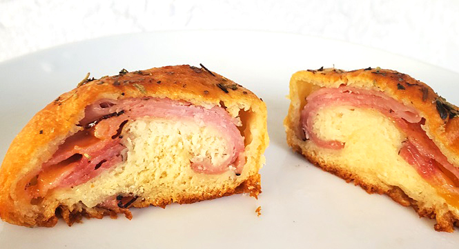 the inside of baked food bombs with ham and cheese