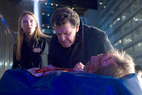FRINGE: Walter (John Noble, R) and Olivia (Anna Torv, L) investigate a death at Massive Dynamic headquarters in the FRINGE episode The Dreamscape