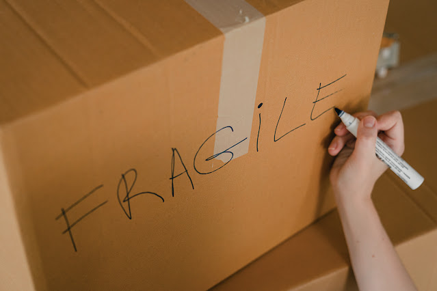 close-up of a cardboard box with 'fragile' written on it
